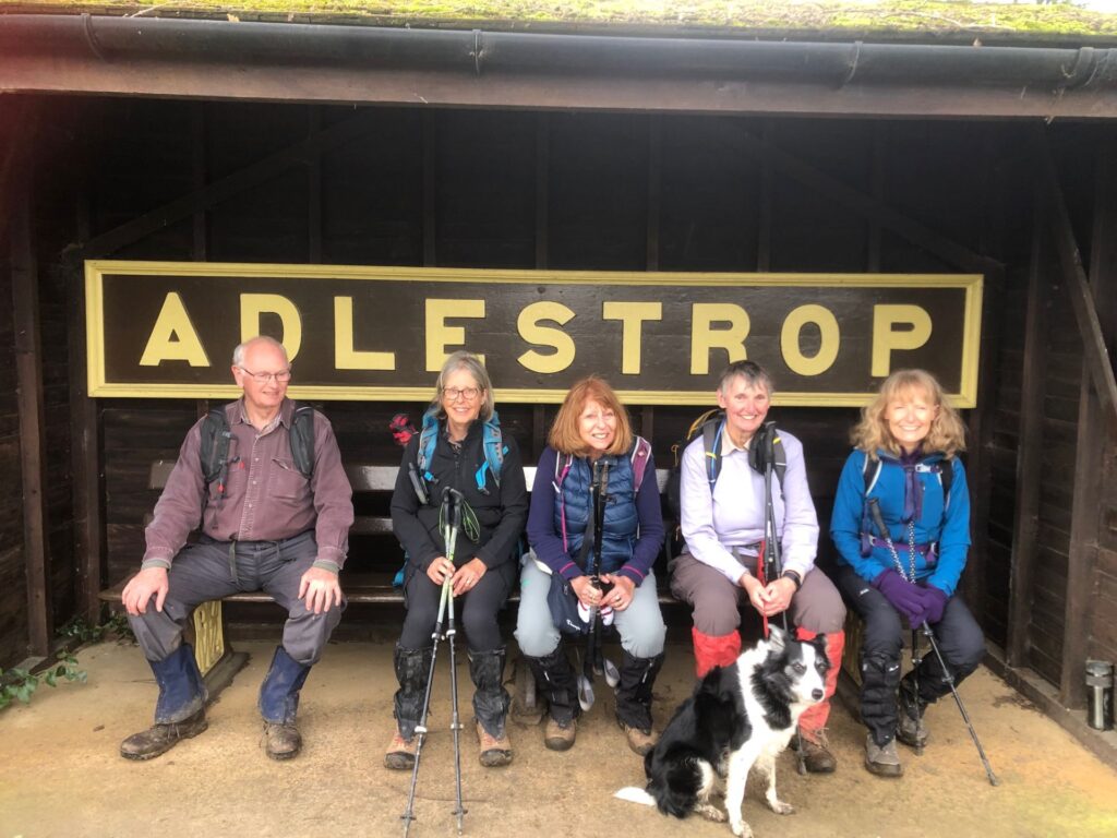 "Group of walkers on a bench"